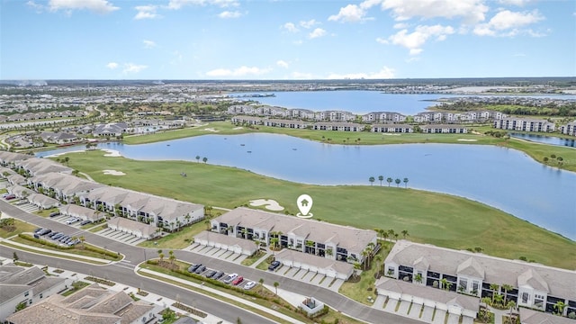 aerial view featuring a residential view, a water view, and golf course view