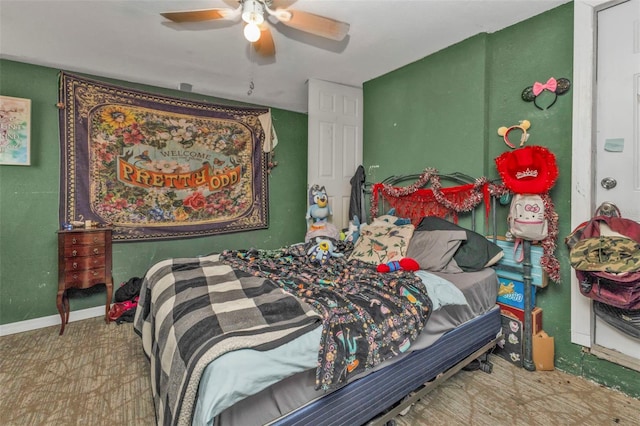 bedroom with ceiling fan and baseboards