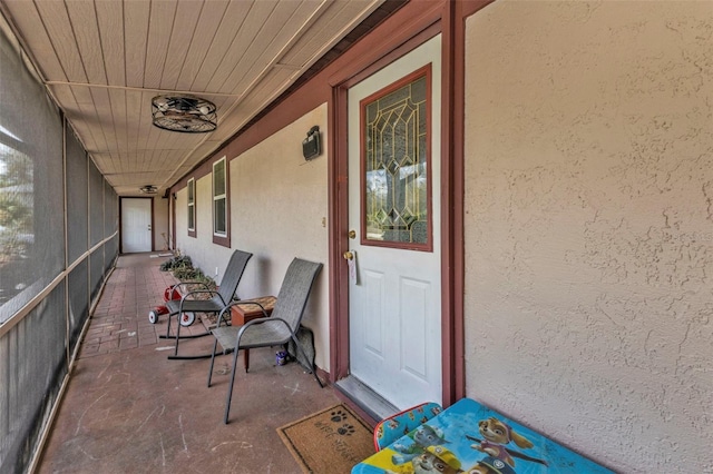 view of exterior entry with stucco siding