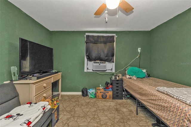 bedroom featuring light floors, cooling unit, ceiling fan, and baseboards