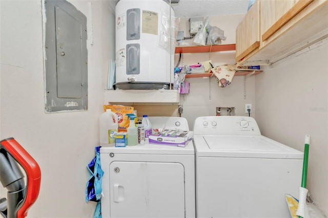 laundry area with washing machine and dryer, electric panel, cabinet space, and water heater