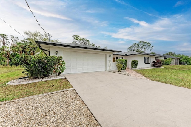 1052 Hinton St, Port Charlotte, FL 33952 - ranch-style house with stucco siding, a front lawn, a garage, and driveway