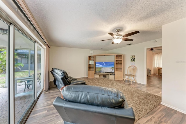 1052 Hinton St, Port Charlotte, FL 33952 - living room with visible vents, wood finished floors, a textured ceiling, and ceiling fan