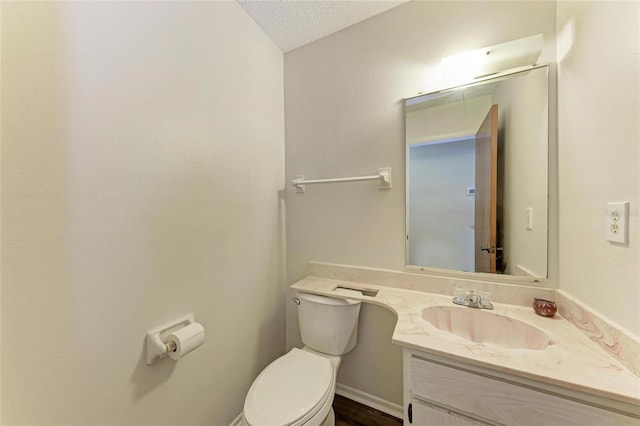 1052 Hinton St, Port Charlotte, FL 33952 - bathroom with vanity, toilet, and a textured ceiling