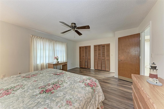 1052 Hinton St, Port Charlotte, FL 33952 - bedroom featuring ceiling fan, multiple closets, a textured ceiling, and dark wood finished floors