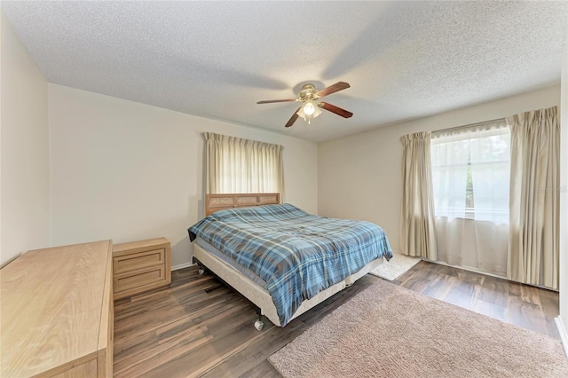 1052 Hinton St, Port Charlotte, FL 33952 - bedroom with a textured ceiling, wood finished floors, and a ceiling fan