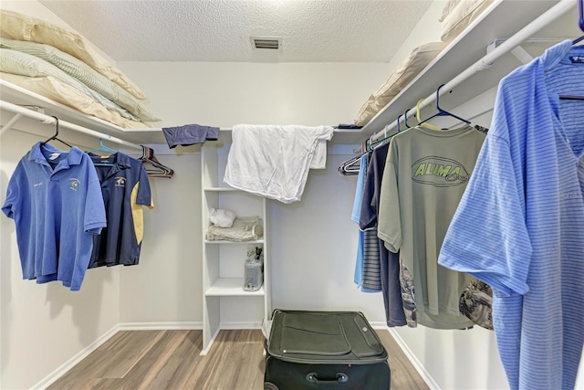 1052 Hinton St, Port Charlotte, FL 33952 - spacious closet featuring visible vents and wood finished floors