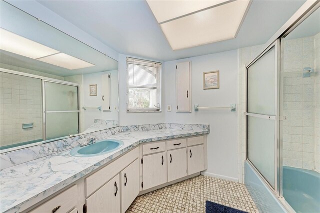 1052 Hinton St, Port Charlotte, FL 33952 - bathroom with vanity, tile patterned floors, baseboards, and enclosed tub / shower combo