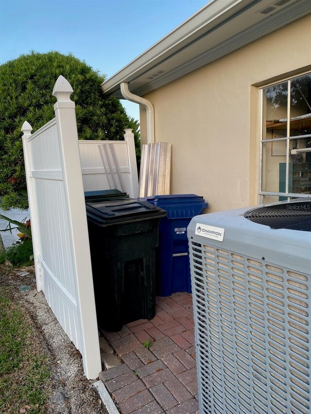 3 Bermuda Cir Unit 49, Englewood, FL 34223 - exterior view of a central AC unit and stucco siding