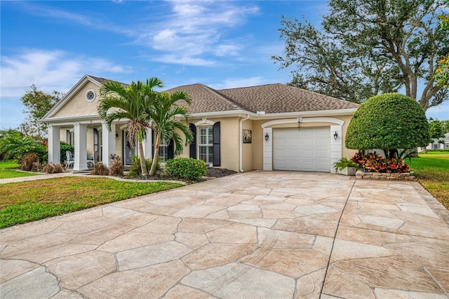 3 Bermuda Cir Unit 49, Englewood, FL 34223 - view of front of home with stucco siding, a garage, a front yard, and concrete driveway