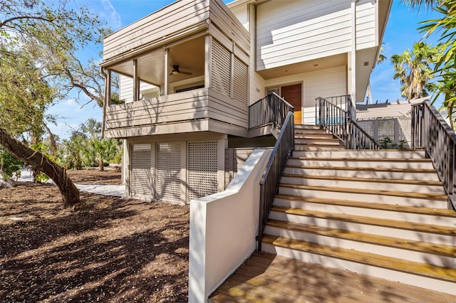 exterior space with a ceiling fan