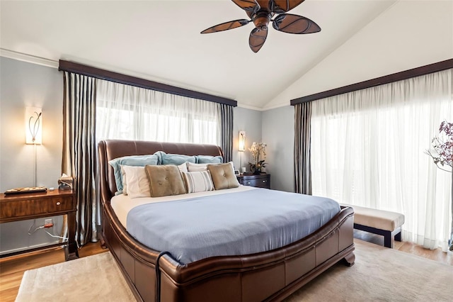 bedroom featuring lofted ceiling, ceiling fan, and wood finished floors