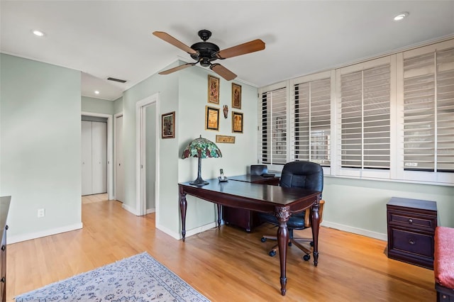 home office with baseboards, ceiling fan, visible vents, and wood finished floors