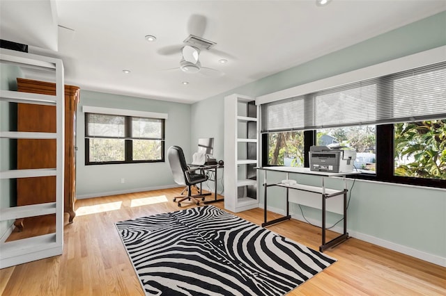 office space featuring recessed lighting, ceiling fan, baseboards, and wood finished floors