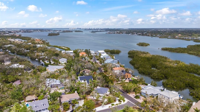 drone / aerial view with a water view and a residential view