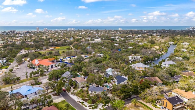 birds eye view of property featuring a water view and a residential view