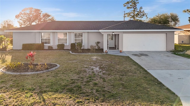 ranch-style home featuring a front yard, driveway, and stucco siding