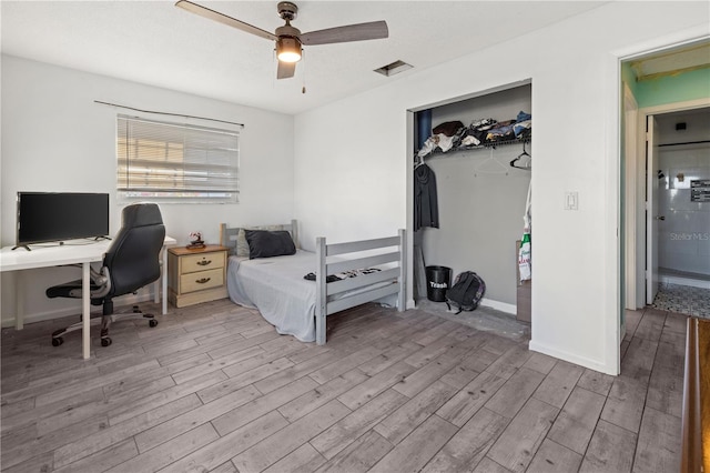 3265 Sunrise Trl, Port Charlotte, FL 33952 - bedroom featuring wood finished floors, a desk, a closet, and a ceiling fan