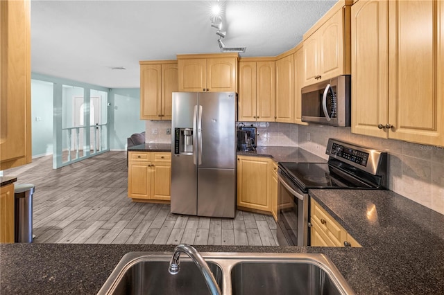 3265 Sunrise Trl, Port Charlotte, FL 33952 - kitchen featuring stainless steel appliances, light brown cabinets, backsplash, and light wood-style floors