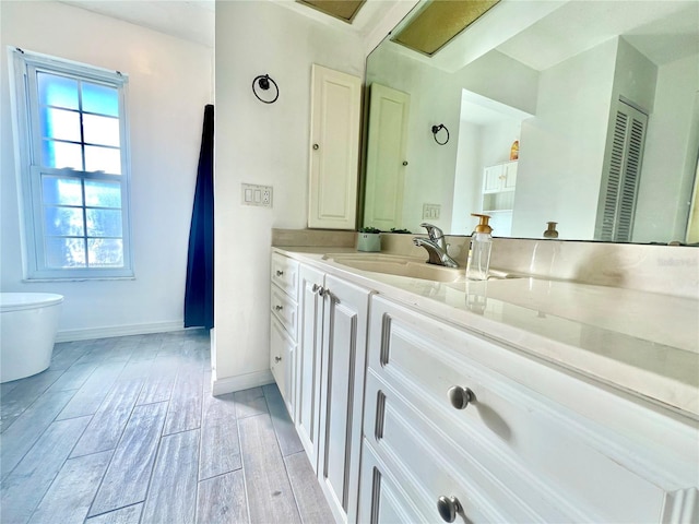 3265 Sunrise Trl, Port Charlotte, FL 33952 - bathroom featuring vanity and wood finished floors