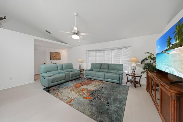 living area with lofted ceiling, ceiling fan, and visible vents