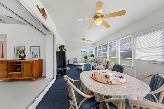 dining space featuring baseboards and light colored carpet