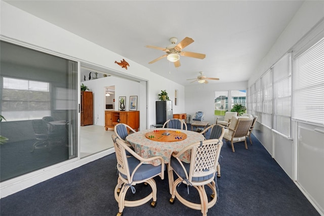 sunroom / solarium featuring a ceiling fan