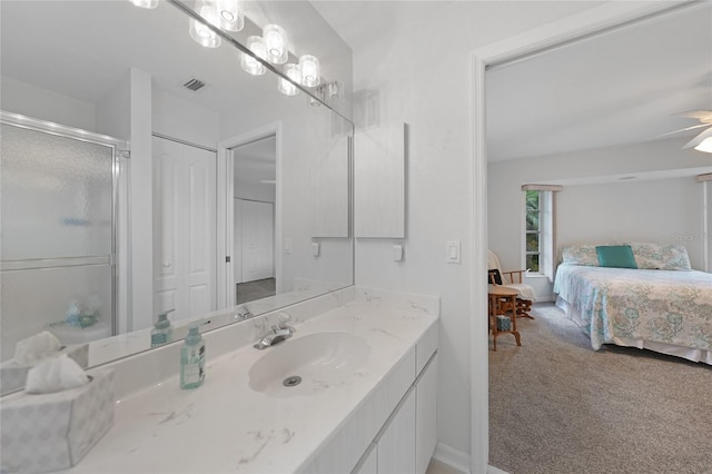 bathroom featuring visible vents, a stall shower, connected bathroom, vanity, and baseboards