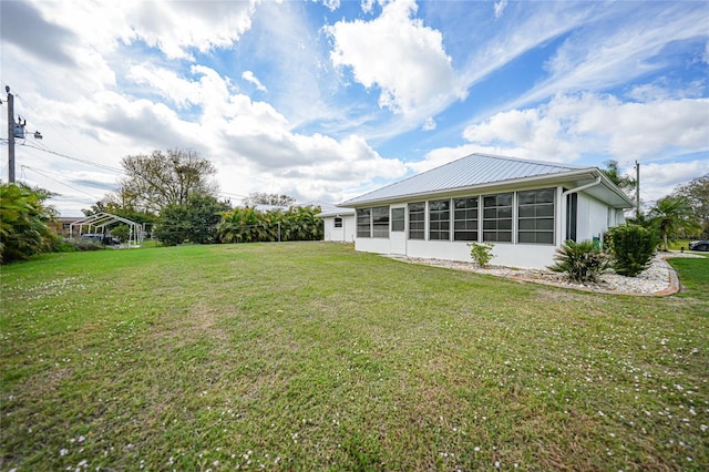 view of yard with a sunroom