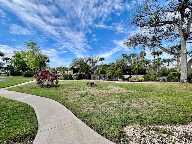 surrounding community featuring a yard