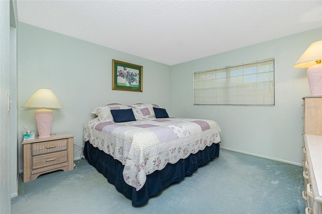 bedroom featuring baseboards, a textured ceiling, and light colored carpet