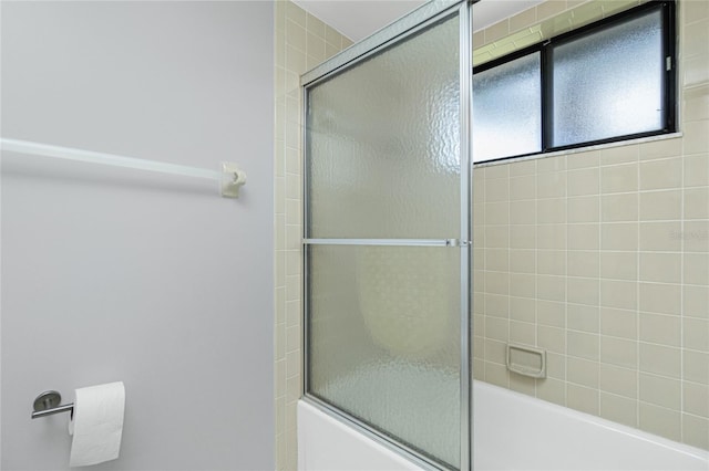 bathroom featuring enclosed tub / shower combo