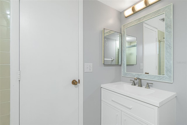 full bath featuring an enclosed shower and vanity