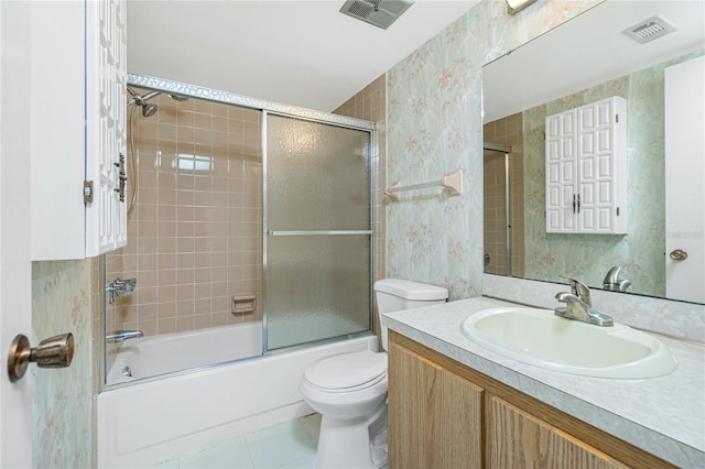 bathroom with toilet, bath / shower combo with glass door, visible vents, and wallpapered walls