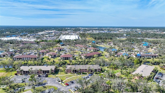 birds eye view of property with a water view and a residential view