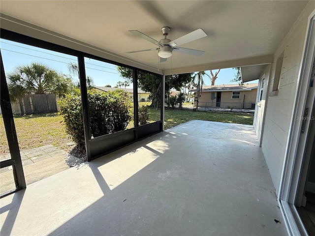 view of patio featuring fence and ceiling fan