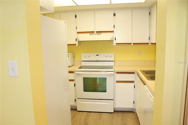 19505 Quesada Ave Unit Mm202, Port Charlotte, FL 33948 - kitchen featuring white appliances, ventilation hood, light wood finished floors, light countertops, and white cabinets