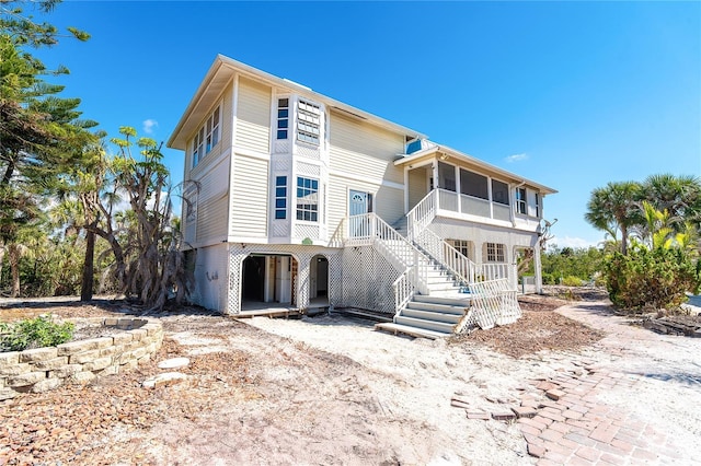 20 Palm Dr, Placida, FL 33946 - back of property with stairway and covered porch