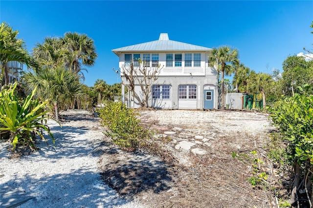20 Palm Dr, Placida, FL 33946 - rear view of property with a standing seam roof and metal roof