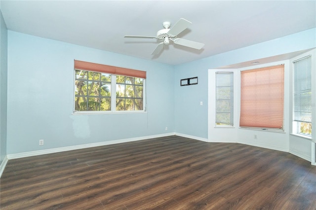 20 Palm Dr, Placida, FL 33946 - empty room featuring plenty of natural light, dark wood finished floors, and baseboards