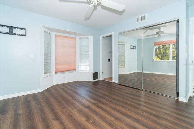 20 Palm Dr, Placida, FL 33946 - unfurnished bedroom featuring wood finished floors, baseboards, ceiling fan, and a closet