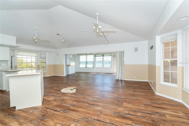 20 Palm Dr, Placida, FL 33946 - unfurnished living room featuring a ceiling fan, vaulted ceiling, track lighting, and dark wood-style floors