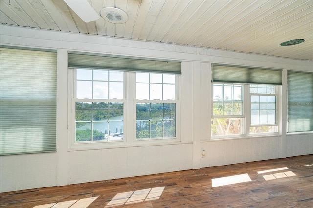 20 Palm Dr, Placida, FL 33946 - unfurnished sunroom featuring wooden ceiling, plenty of natural light, wood finished floors, and a water view