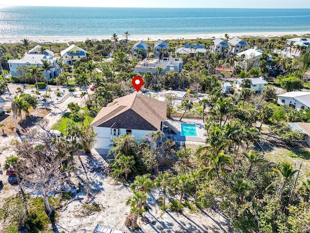 birds eye view of property with a water view and a residential view