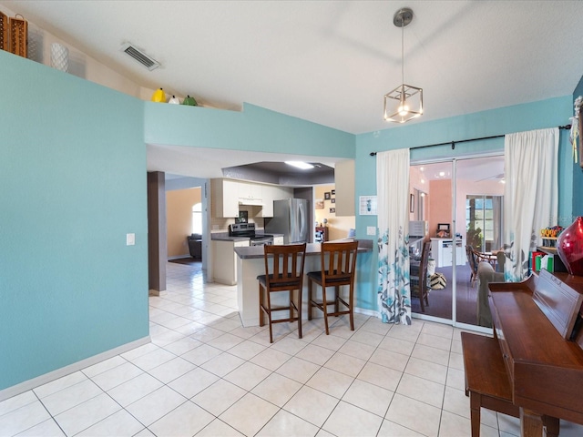 dining area with visible vents, baseboards, and light tile patterned floors