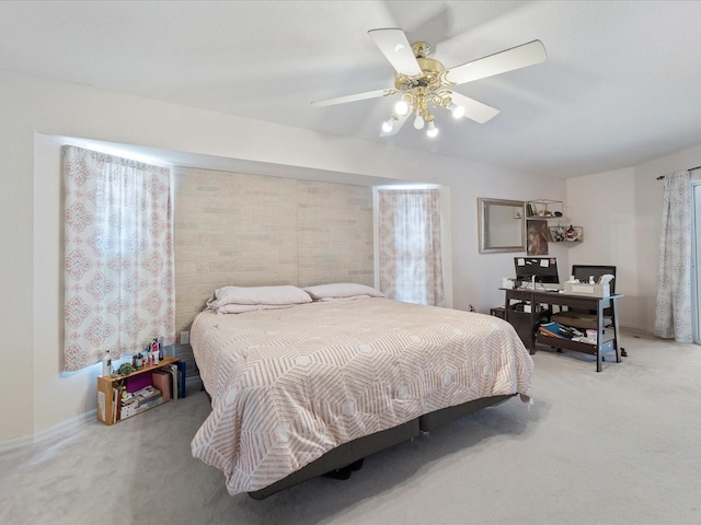 bedroom featuring ceiling fan and light colored carpet