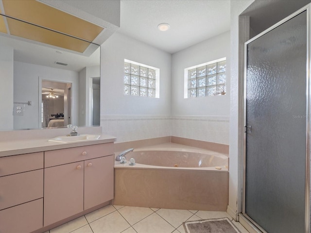 full bath with tile patterned floors, a shower stall, ensuite bath, vanity, and a bath