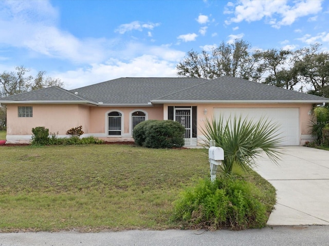 ranch-style home featuring a garage, a front yard, concrete driveway, and stucco siding