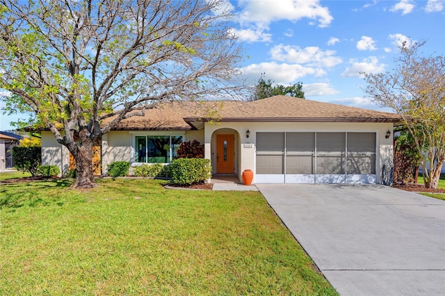 ranch-style home featuring an attached garage, concrete driveway, roof with shingles, stucco siding, and a front lawn