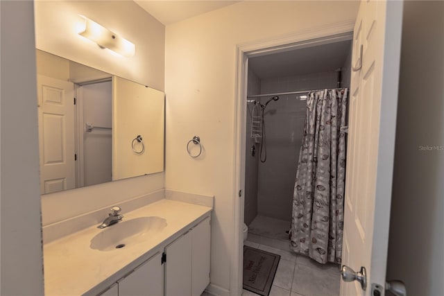3300 Loveland Blvd Unit 2103, Punta Gorda, FL 33980 - bathroom featuring a shower stall, toilet, tile patterned flooring, and vanity